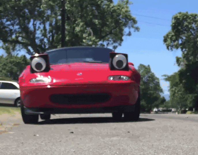 Red car with cartoonish eyes